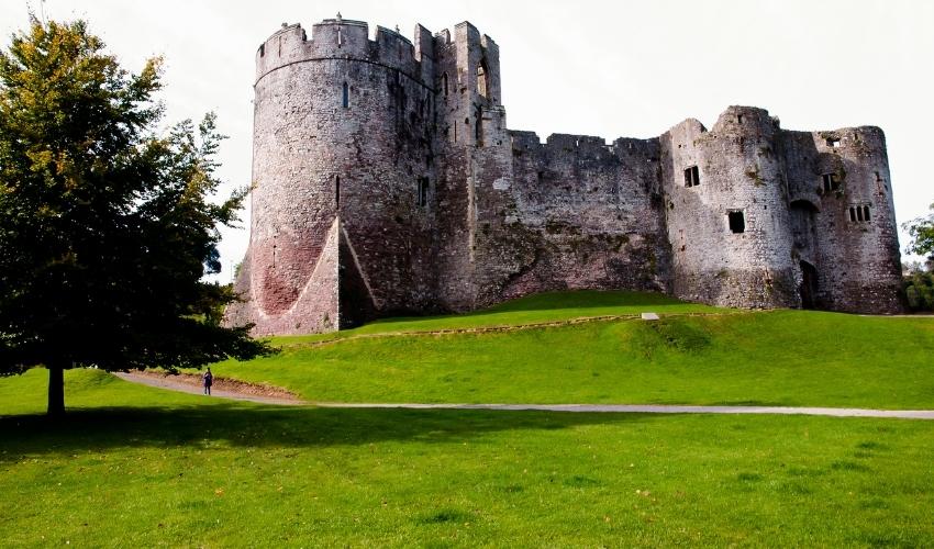Historic Chepstow Castle remains under blue sky
