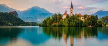 Scenic view of Lake Bled with its iconic island church and surrounding mountains