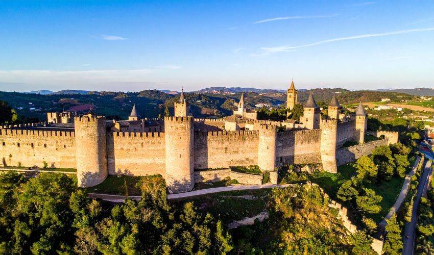 Historic Templar castle fortress in Portugal surrounded by green countryside