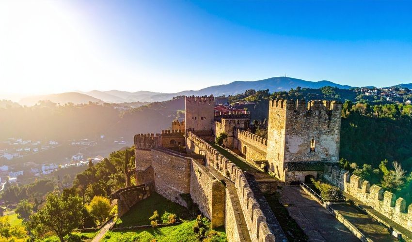 Medieval Templar castle in Portugal with stone towers and beautiful countryside view