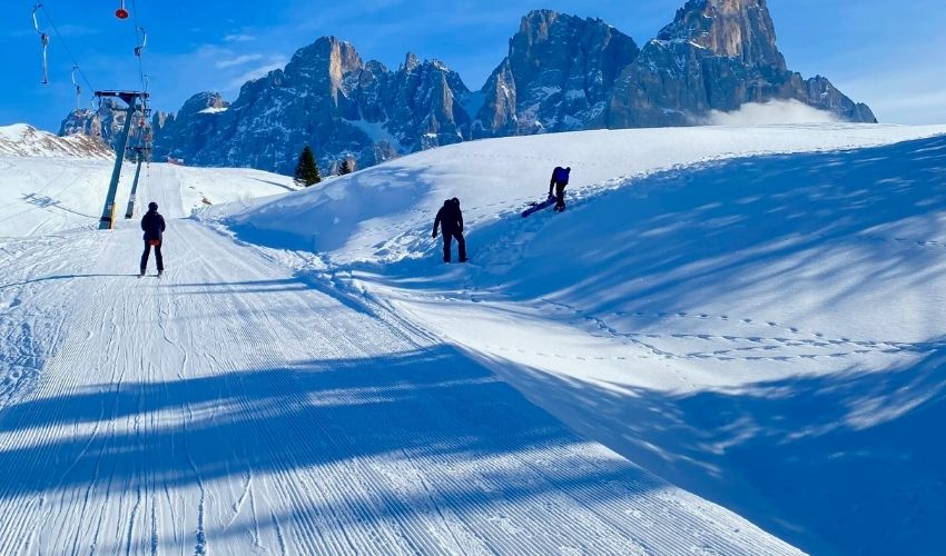 people skiing on Dolomiti Superski network