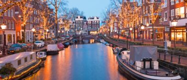 A picturesque dusk scene of a canal in Amsterdam